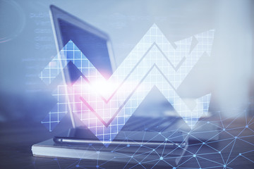 Computer on desktop with point up arrows hologram. Double exposure. Concept of success.