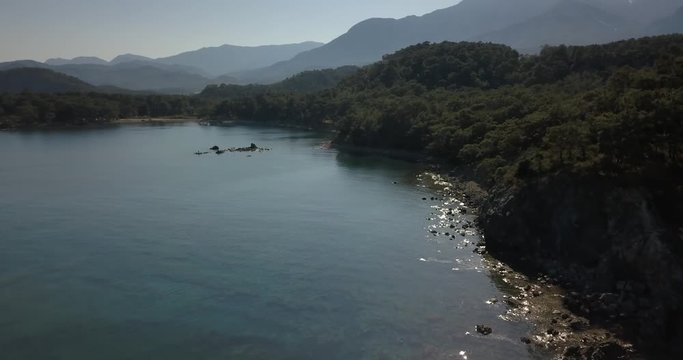 Aerial footage of a gorgeous coastline with forests and mountains, Turkey, 4k