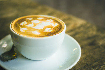 cup of coffee on wooden table