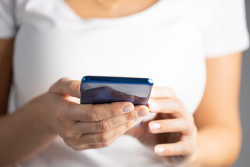 Woman hand using smart phone