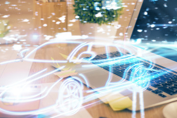 Desktop computer background in office with automobile hologram drawing. Multi exposure. Tech concept.