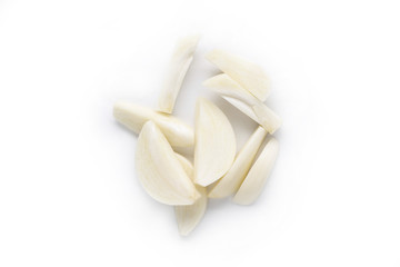 chopped garlic cloves isolated on white. garlic is low in calories and rich in vitamin C, vitamin...