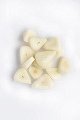 collection of chopped garlic on white, remedy from all illneses, colds. fresh beneficial ingredient for various dishes, one clove has many useful properties