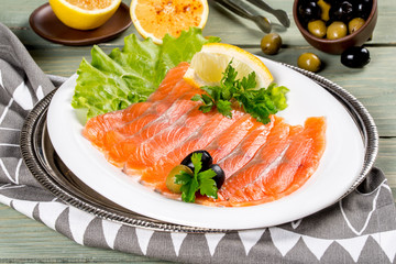 Sliced salmon served on a white plate