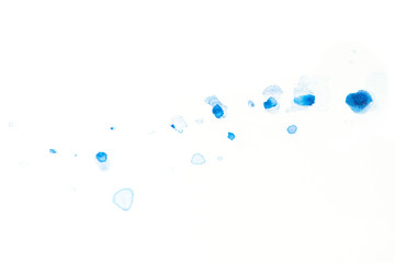 blue watercolor paint droplets on a white background