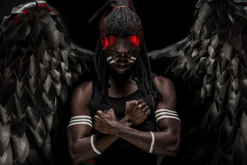 afro-american young guy became dark angel and fall from heaven to be with all alive people, he is suffering from pain of being among the dead. fantasy, gothic cocnept