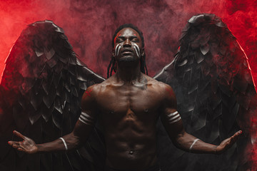 portrait of dark angel with grand black wings on his back, black angel descended from heaven, he...