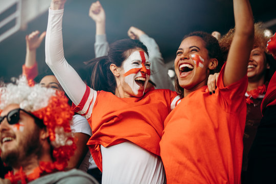 Female soccer fans celebrating championship win