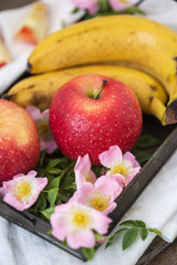 Apples and bananas snack decorated with flowers