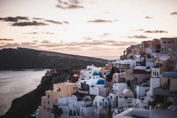 Fototapeta na wymiar view of whitewashed houses and blue dome in oia Santorini Greece
