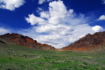 blue sky and white clouds over the vast Mongolian steppes