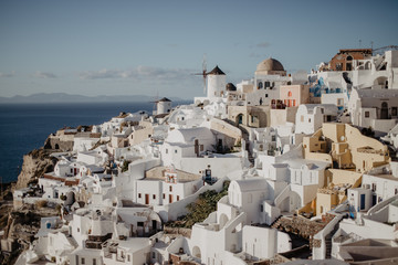 view of whitewashed houses and blue dome in oia Santorini Greece