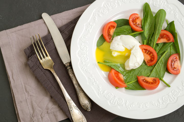healthy diet. Medium boiled egg with fresh spinach.