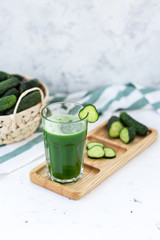 Fresh-pressed cold cucumber juice on the table