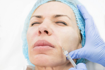 The procedure of therapeutic injections to rejuvenate the skin and smooth wrinkles.