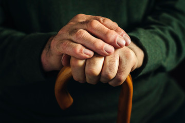 Gnarled arthritic fingers of an old man