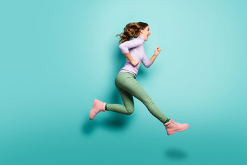 Fototapeta na wymiar Full length profile photo of pretty crazy lady jumping high up speed rushing black friday shopping center wear lilac jumper green pants shoes isolated teal pastel color background