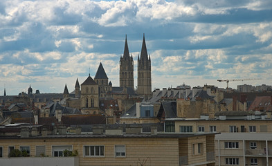 Obraz premium Cityscape of French city Caen with high tower of an catholic cathedral