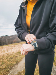 Adult woman jogging / exercising on a mountain road in nature.