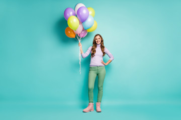 Full length photo of pretty funky lady carry many colorful air balloons arranging surprise party...