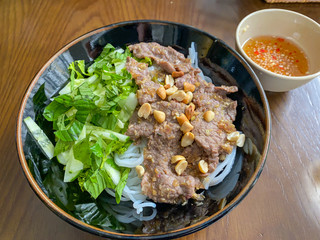 Bowl of braised beef rice noodles served with fish sauce