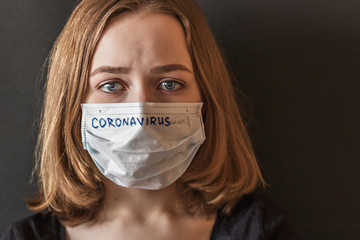 Close-up portrait of a girl in a mask of exhilaration with suspected coronavirus. New...