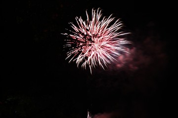 Colors explode in the dark night from fireworks