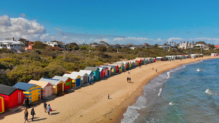 Naklejka premium BRIGHTON BEACH, AUSTRALIA - SEPTEMBER 2018: Aerial view of Brighton Beach Colourful Huts, Victoria, Australia