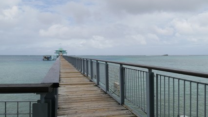 Long wooden walkway to the Eye Marine Park, a top attraction on Guam.
