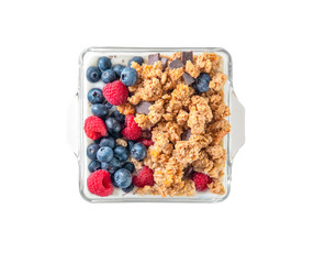 Breakfast of granola and wild berries. Delivered in a glass plate