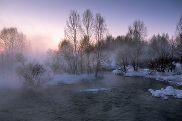 Foggy morning. The beginning of spring. Dawn on the river. Change of seasons. Melting snow.