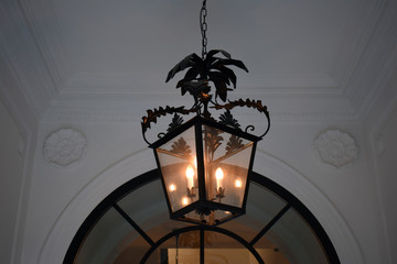 Vintage Ornate Black Steel Hanging Lantern in Foyer of Building 