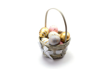 Easter basket. Colorful shine decorated eggs in basket isolated on white background. Greeting card trendy design.