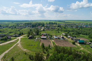 Fototapeta na wymiar Kaygorodskoe village, Houses and gardens. Russia, Sverdlovsk region. Aerial, summer, sunny