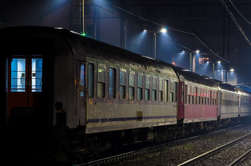 RAILWAY - Railroad cars at station in the rain