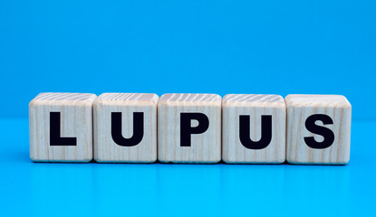 concept word lupus on cubes on a blue beautiful background