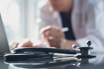 Doctor working on laptop computer