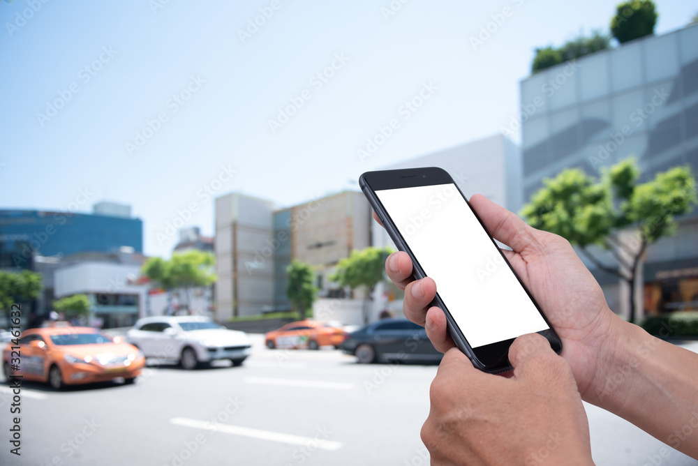 Poster mockup man using mobile phone with traffic background
