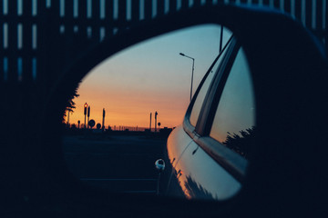 Sunset in car side mirror