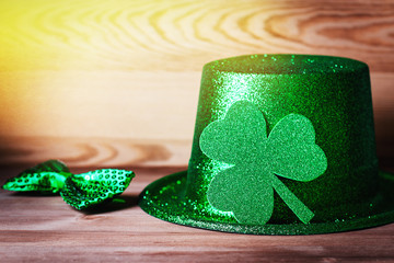 Happy Saint Patrick's Day greeting card with traditional symbols, shamrock, green attire. Green...