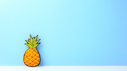 pineapple  flat image, pastel blue background, copy space.