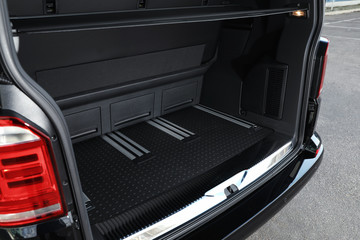 Modern car with open empty trunk outdoors