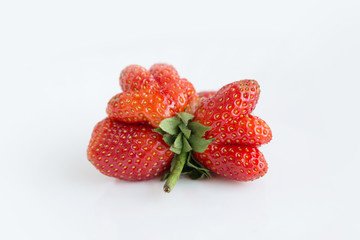 Strawberry Mutant. Red strawberry in the form of a heart on a white background.