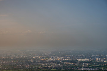 Aerial view of black smoke above city.  Almaty city air pollution problems concept. Urban cityscape