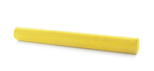 Piece of yellow chalk isolated on white