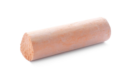 Small piece of orange chalk isolated on white