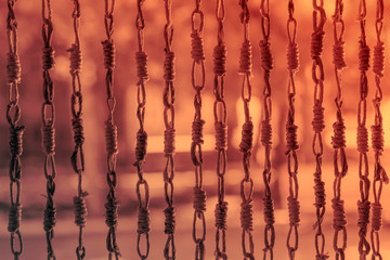 Traditional wicker entrance curtain background. Wicker curtain background. Traditional curtain. Background. Bamboo curtain. Sunset. Sunrise.