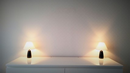 Two burning floor lamps on a white glass table against a white wall in a dark room with sockets at the top with vignetting at the edges.