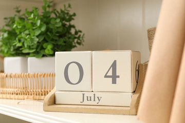White shelving unit with calendar and decorative elements