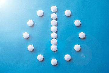 6 o clock made of pills. Abstract medical background. Medication time concept. Medicine drug icon. Time to take medicine.